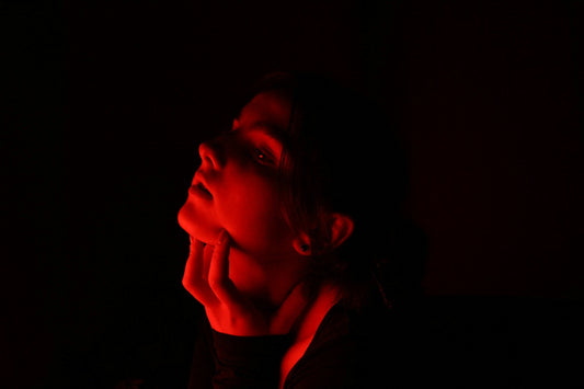 Woman receiving red light therapy for skin rejuvenation, highlighting the soothing effects of photobiomodulation.
