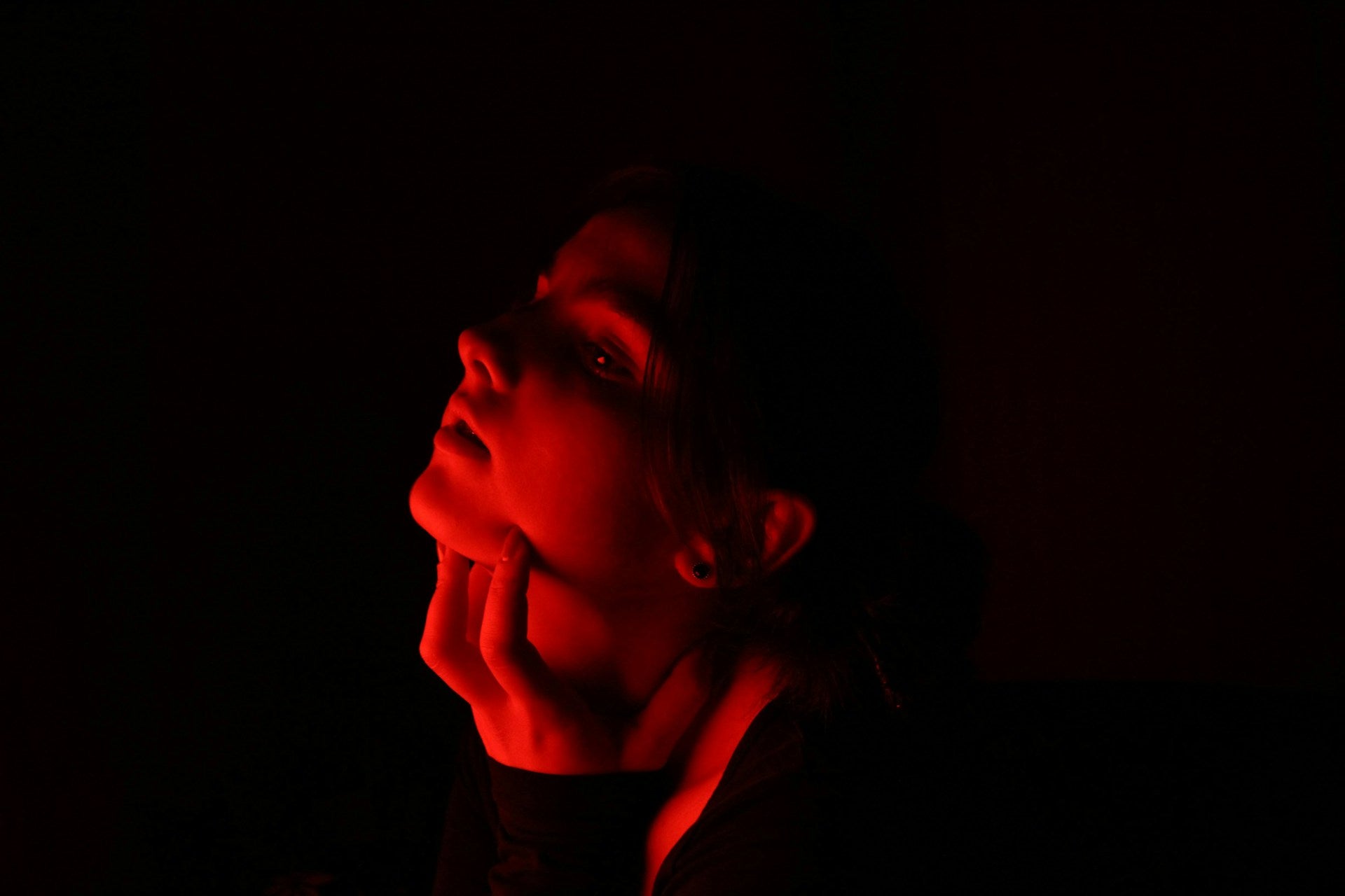 Woman receiving red light therapy for skin rejuvenation, highlighting the soothing effects of photobiomodulation.