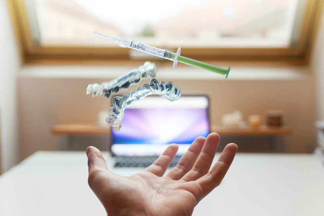 Floating dental whitening kit tools over a desk, symbolizing precision and innovation in whitening care.