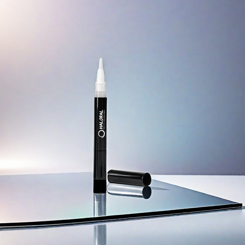 Haloral Halo PAP+ Teeth Whitening Pen on a reflective surface, designed for quick and precise teeth whitening on the go