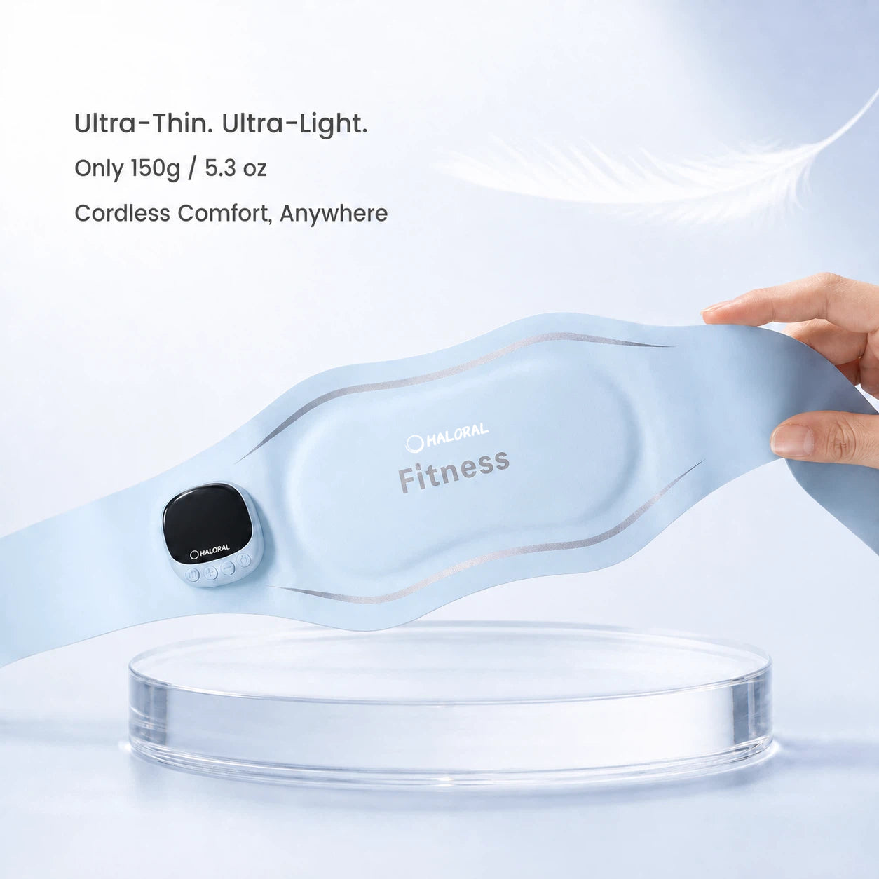 Haloral EMS Ab Toning Belt being held to demonstrate its ultra-thin, cordless and lightweight 150 g design