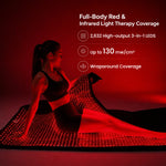 Woman using the Haloral Full Body Red and Infrared Light Therapy Bag with 2,632 high-output 3-in-1 LEDs, up to 130 mW/cm² irradiance and wraparound coverage.