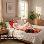 Woman and dog relaxing on Haloral full-body red light therapy mat, illustrating comfortable design suitable for humans and pets.